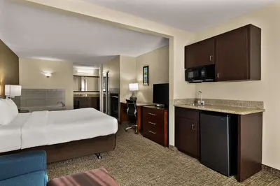 a hotel room with a bed and a kitchen at Comfort Inn & Suites Sequoia Kings Canyon in Three Rivers
