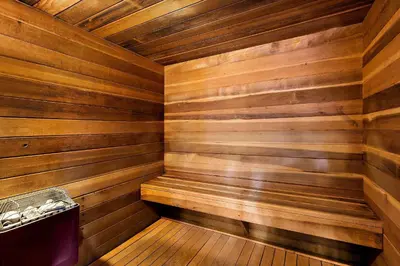 a sauna with wooden walls and a wooden floor at Comfort Inn & Suites Sequoia Kings Canyon in Three Rivers