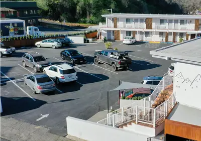 an aerial view of a parking lot with cars parked at Hotel Lumberjack - Sonora in Sonora