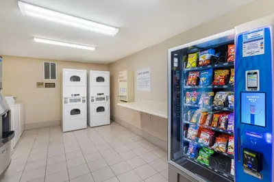 a convenience store aisle with a soda vending machine at Comfort Inn & Suites Near Fallon Naval Air Station in Fallon