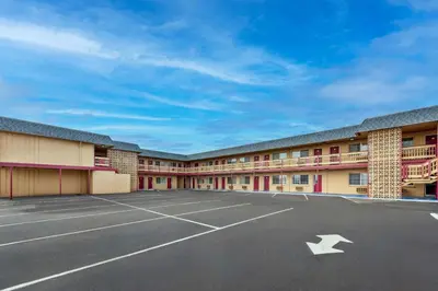 an empty parking lot in front of a motel at Econo Lodge Fallon Naval Air Station Area in Fallon