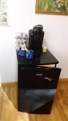a black cabinet with a coffee maker on top of it at Winterfell Inn - No Xtra Fees, Dogs OK, King & Queen Suites in Arnold