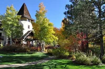 an autumn view of a house with trees at Olympic Village Inn Olympic Valley in Olympic Valley