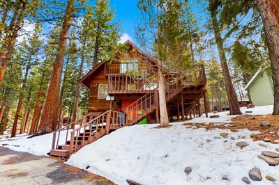a log cabin in the woods in the snow at Take me back to Talbot in South Lake Tahoe