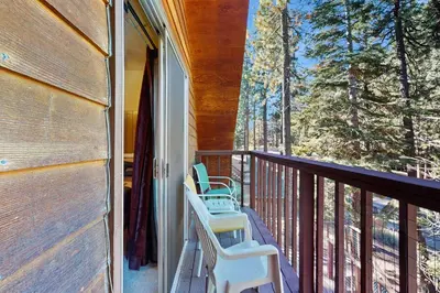 a porch with chairs and a view of the woods at Take me back to Talbot in South Lake Tahoe