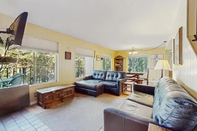 a living room with a couch and a table at Take me back to Talbot in South Lake Tahoe