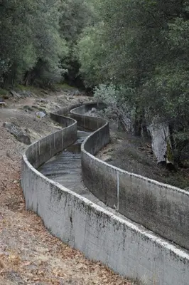 a set of concrete barriers on a hill with trees at Yosemite Foothill Retreat - Private Guest Suite #2 in Coarsegold