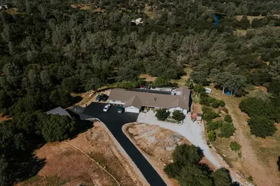 an aerial view of a house with a driveway at Yosemite Foothill Retreat - Private Guest Suite #3 in Coarsegold