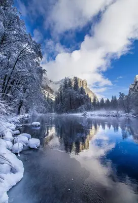 a river with snow covered trees and a mountain at Yosemite Foothill Retreat - Private Guest Suite #3 in Coarsegold