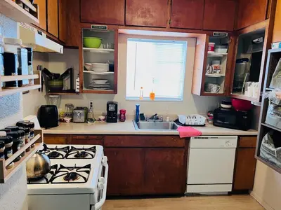 a kitchen with a white stove and a sink at WHOLE Family - WholeVille in Sacramento