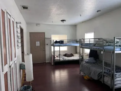a room with two bunk beds and a hallway at WHOLE Family - WholeVille in Sacramento