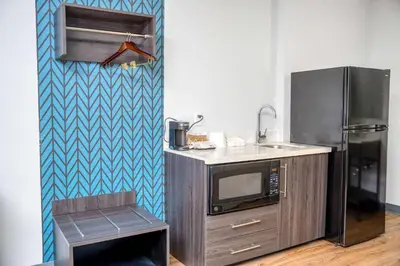 a kitchen with a microwave and a refrigerator at Studio 6 Suites Stockton, CA Waterfront in Stockton