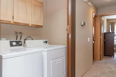 a laundry room with a washer and dryer at Snowcreek IV 588 in Mammoth Lakes