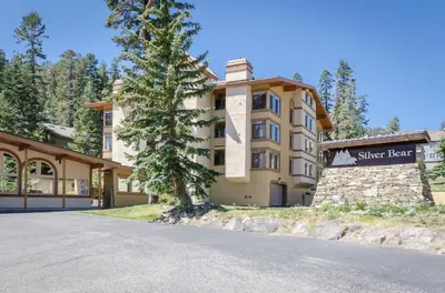 a building with a sign for a ski resort at Silver Bear #19 Condo in Mammoth Lakes