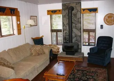 a living room with a couch and a fireplace at Birch Creek #8 - 2BR/1.5BA in June Lake