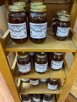 a bunch of jars of honey on a shelf at Bristlecone Motel in Big Pine