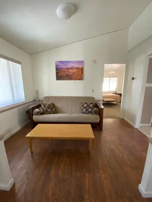 a living room with a couch and a coffee table at Bristlecone Motel in Big Pine