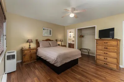 a bedroom with a bed and a ceiling fan at Arnold Meadowmont Lodge in Arnold