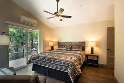 a bedroom with a bed and a ceiling fan at 11R Spring Meadow Retreat in Wawona
