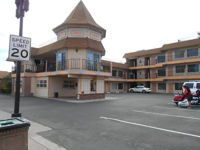 a parking lot in front of a large building at Victorian Inn in Reno