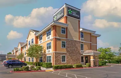 a hotel building with a sign on top of it at Extended Stay America Suites - Stockton - Tracy in Tracy