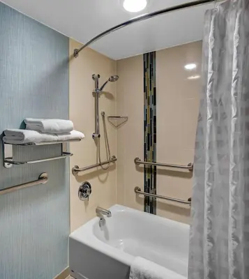 a bathroom with a tub and a shower and a sink at Hyatt Place Sacramento Rancho Cordova in Rancho Cordova