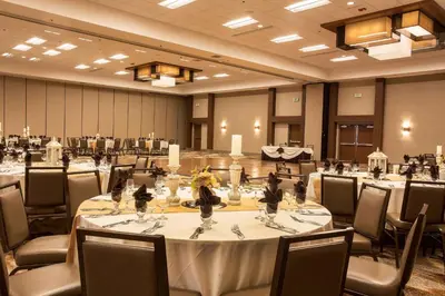 a large banquet room with tables and chairs at DoubleTree by Hilton Fresno Convention Center in Fresno