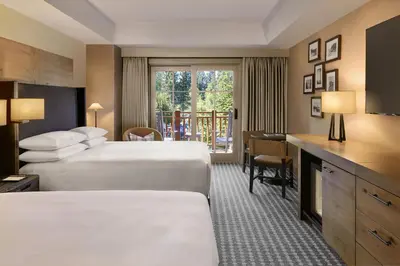 a hotel room with two beds and a balcony at Hyatt Regency Lake Tahoe Resort, Spa & Casino in Incline Village