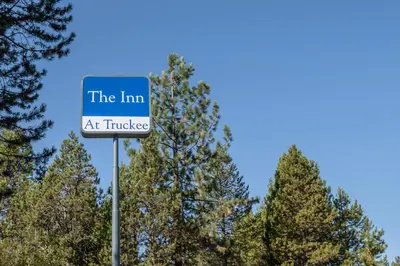 a sign that reads the inn at truke at Inn At Truckee in Truckee