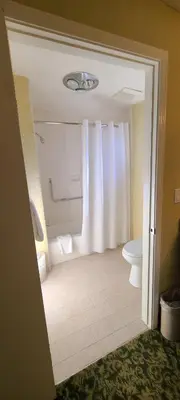 a bathroom with a toilet and a sink at Dow Villa Motel in Lone Pine