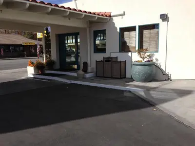 a front porch of a building with a flower pot at Dow Villa Motel in Lone Pine