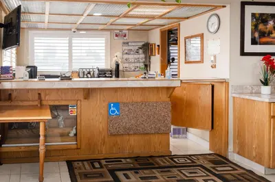 a kitchen with a large counter with a sink at Budget Inn Corcoran Near Tulare CA 43 in Corcoran