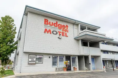 a building with a burger king movie sign on it at Budget Inn Corcoran Near Tulare CA 43 in Corcoran