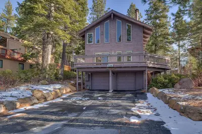 a house with a balcony and a driveway at Sunny Daze at Dollar Point by Tahoe Getaways - Tahoe Classic w Open Floor Plan, Wood Fireplace, Close to Lake! in Tahoe City