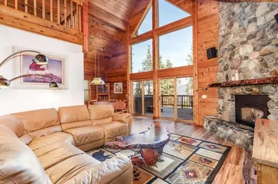 a living room with a couch and a fireplace at Scenic Wonders & Apt. in Yosemite West