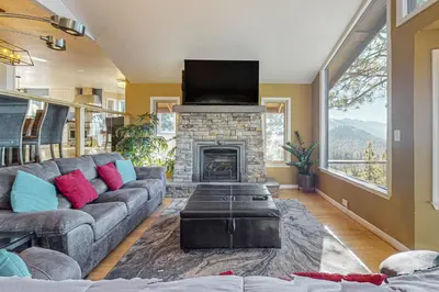 a living room with a couch and a fireplace at The Lake Labyrinth in Zephyr Cove