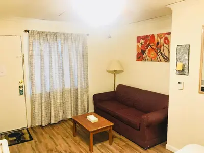 a living room with a couch and a table at El Dorado Motel in Twain Harte