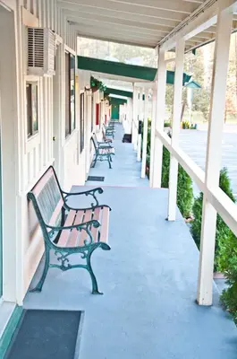 a row of benches sitting on a building at El Dorado Motel in Twain Harte