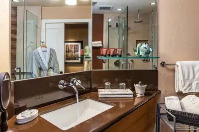 a bathroom with a sink and a mirror at Eden Vale Inn in Placerville