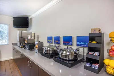 a kitchen with two pots and pans on a counter at Best Western Capital City Inn in Sacramento