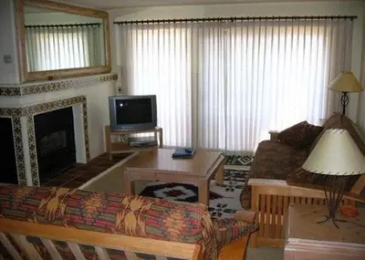 a living room with a couch and a fireplace at Rr-interlaken 26 in June Lake