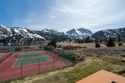 an aerial view of a tennis court with snow covered mountains at Rr-interlaken 26 in June Lake