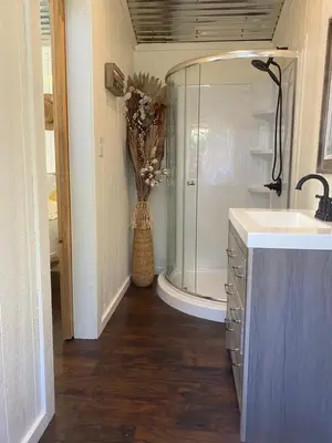 a bathroom with a shower and a sink and a counter at McMillan Ranch Yosemite in Coarsegold