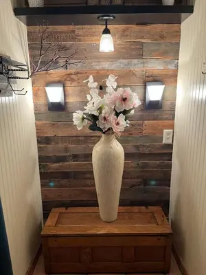 a vase of flowers on a table in a hallway at McMillan Ranch Yosemite in Coarsegold