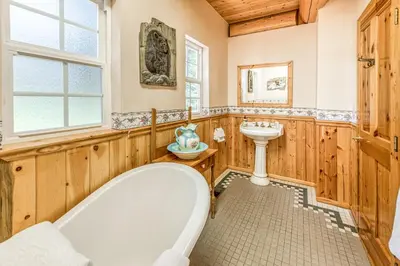 a bathroom with a tub and a sink at Vienna Villa - 3 Bed 3 Bath Vacation home in Shaver Lake in Shaver Lake