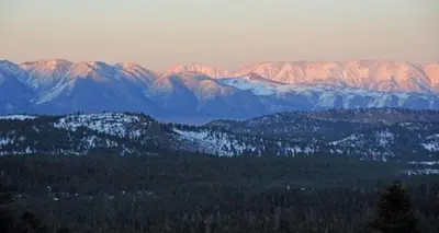 a view of a mountain range with snow covered mountains at Mammoth Point by 101 Great Escapes in Mammoth Lakes