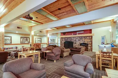 a living room with couches and a fireplace at Tahoe Donner Tree House Retreat in Truckee