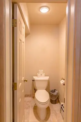 a bathroom with a white toilet in a room at Beautiful 3500sf Lake Tahoe Home W/ Open Layout in Zephyr Cove