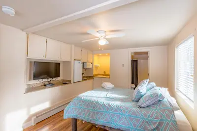 a bedroom with a bed and a ceiling fan at Beautiful 3500sf Lake Tahoe Home W/ Open Layout in Zephyr Cove