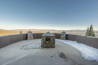 a brick oven on a patio with snow on the ground at Skislope-Tahoe Villa in Truckee